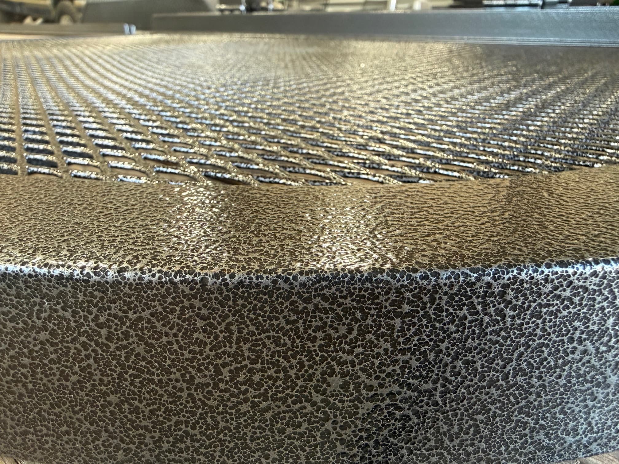 Close-up detail of textured cover finish with mesh grate